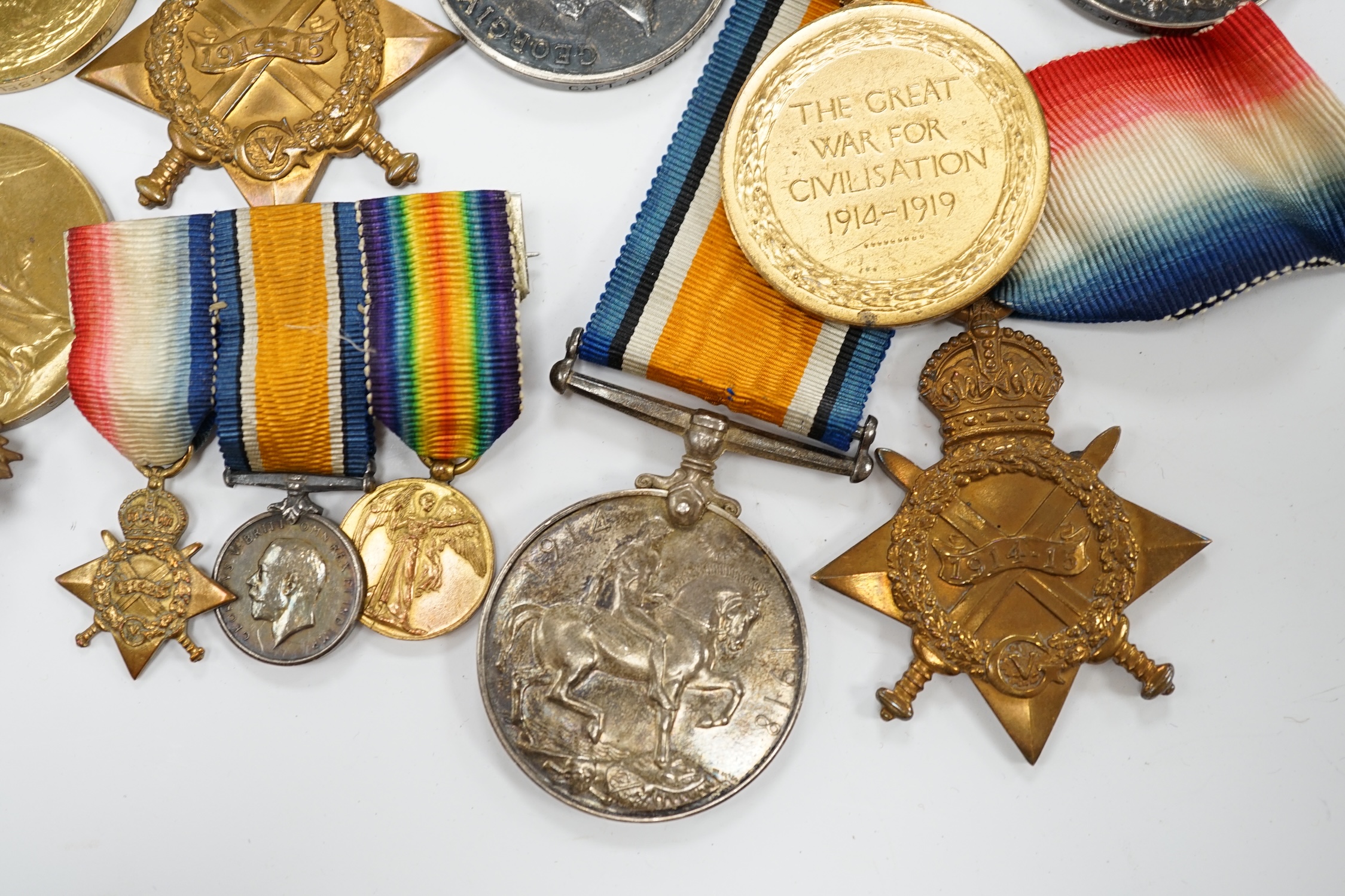 Three First World War medal trios awarded to; Pte. W.C. Belfrage 3rd Canadian MTD Rifles, Cpl. R.W. Wells R.F.A. and Pte. F.G. Walker R.A.M.C. together with two additional British war medals, two miniature metal groups,